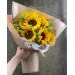 Букет цветов из оранжевых подсолнухов (9 штук, экстра класс) и декоративной зелени с доставкой по Киеву.